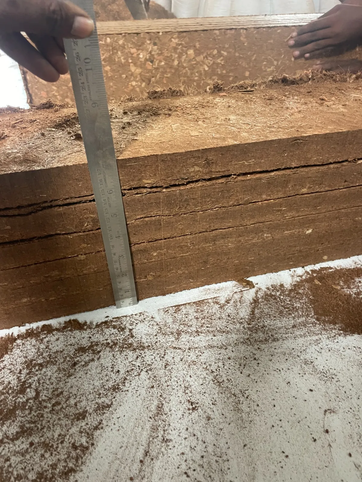 Coir grow-bag slab thickness being checked